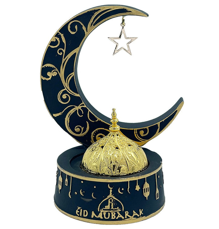A black crescent moon shaped incense burner